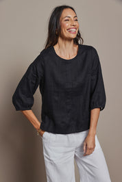 Model Amanda wearing size 10 of the Linen 3/4 Sleeve Top in colour Black (Black), from the front, cropped image