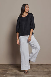 Model Amanda wearing size 10 of the Linen 3/4 Sleeve Top in colour Black (Black), from the front, showing the whole outfit