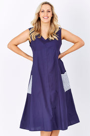 Model Jess wearing size 14 of the Natural Ain colourline Dress - Blueberry (Blue), from the front, cropped image