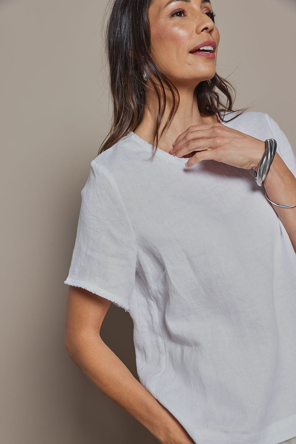 Model Amanda wearing size 8 of the Linen Short Sleeve Top in colour White (White), from the front, cropped image