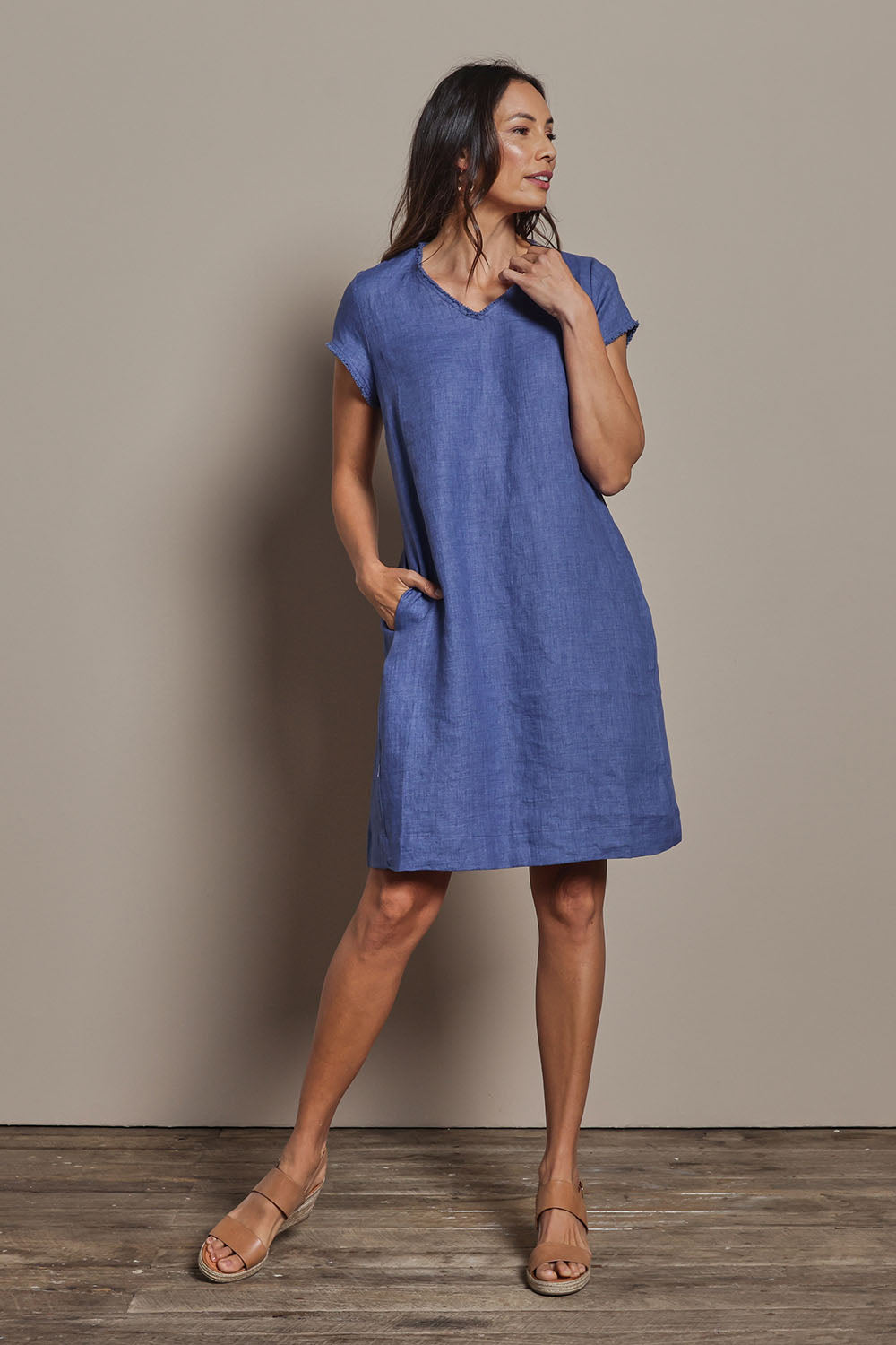 Model Amanda wearing size 10 of the Linen V Neck Shift Dress in colour Denim (Blue), from the front, showing the whole outfit