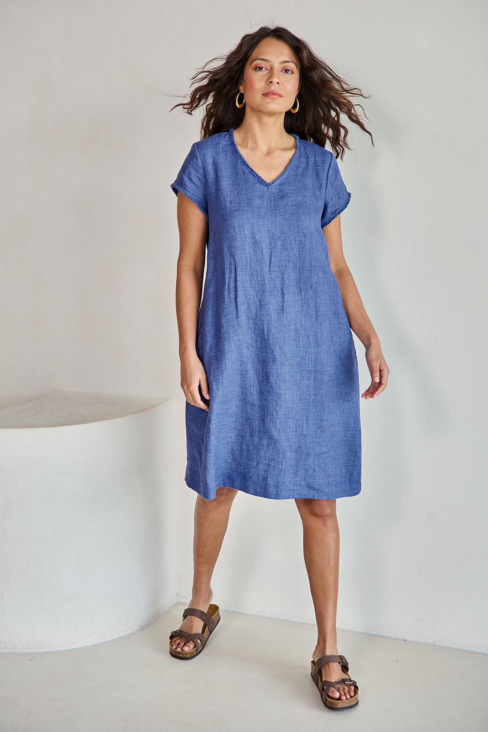 Model Tahneei wearing size 10 of the Linen V Neck Shift Dress – Denim in colour Denim, from the front