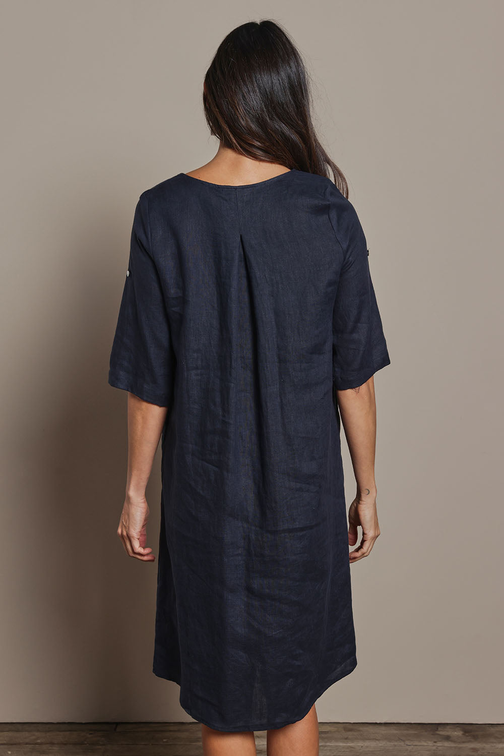 Model Amanda wearing size 10 of the Linen Pocket Dress in colour Navy (Blue), from the back