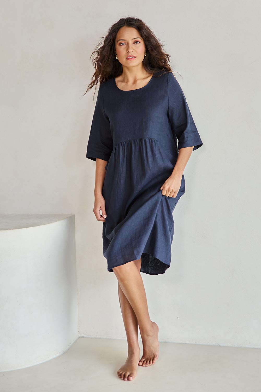 Model Tahneei wearing size 10 of the Linen Pocket Dress – Navy in colour Navy, from the front