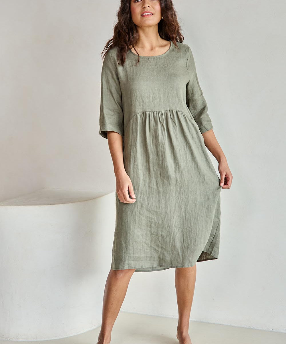 Model Tahneei wearing size 10 of the Linen Pocket Dress – Olive in colour Olive, from the front