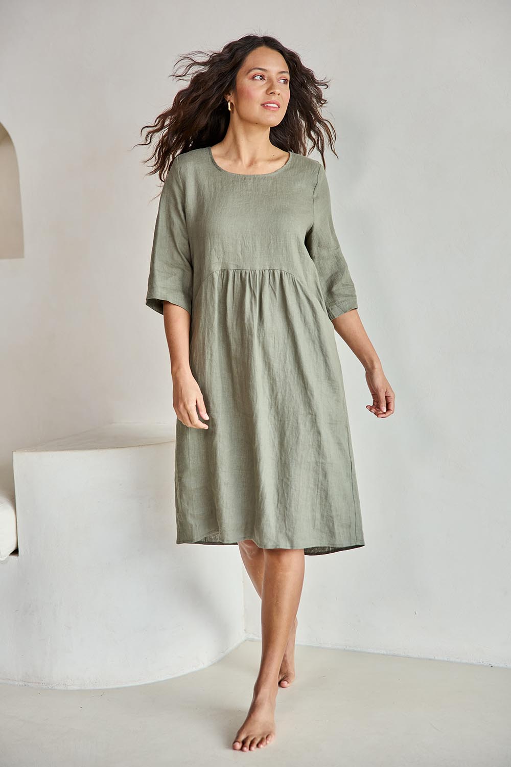 Model Tahneei wearing size 10 of the Linen Pocket Dress – Olive in colour Olive, from the front