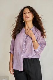 Model Tahneei wearing size 10 of the Cotton Button Down Blouse – Grape in colour Grape, in a cropped view