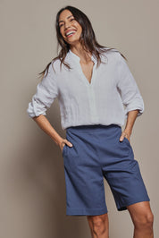 Model Amanda wearing size 10 of the Linen Cotton Pull On Shorts in colour Denim (Blue), from the front, cropped image