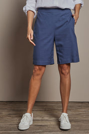 Model Amanda wearing size 10 of the Linen Cotton Pull On Shorts in colour Denim (Blue), from the front, cropped image