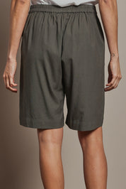 Model Amanda wearing size 10 of the Linen Cotton Pull On Shorts in colour Khaki (Green), from the back