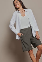 Model Amanda wearing size 10 of the Linen Cotton Pull On Shorts in colour Khaki (Green), from the front, cropped image