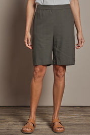 Model Amanda wearing size 10 of the Linen Cotton Pull On Shorts in colour Khaki (Green), from the front, cropped image
