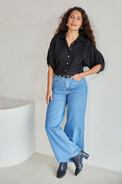 Model Tahneei wearing size 10 of the Linen Pleated Sleeve Shirt – Black in colour Black, from the front