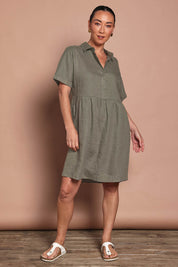 Model Katie wearing size 10 of the Linen Throw On Dress in colour Olive (Green), from the front, showing the whole outfit