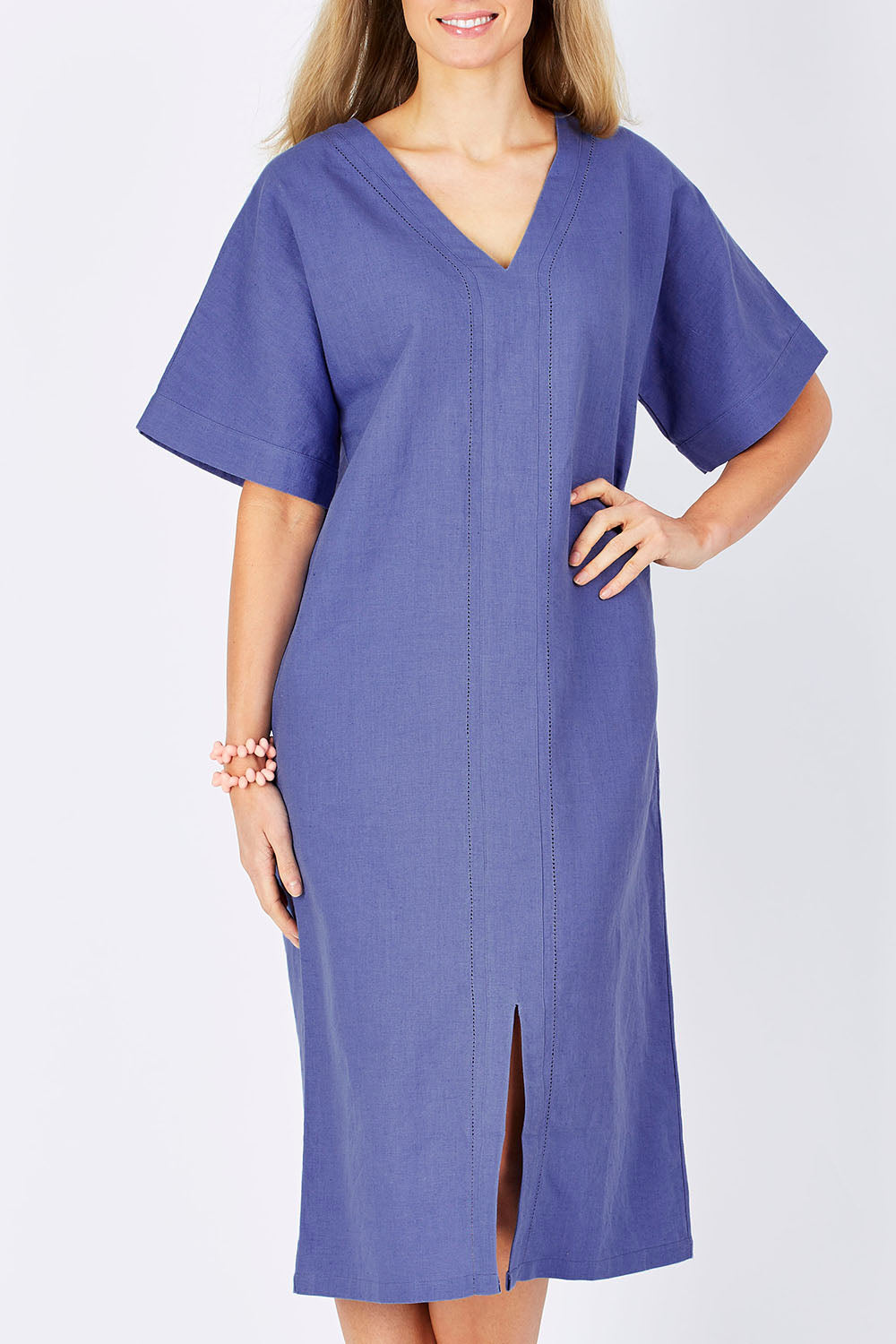 Model Maddy wearing size 10 of the Natural Throw Dress in colour Fleet (Blue), from the front, showing the whole outfit