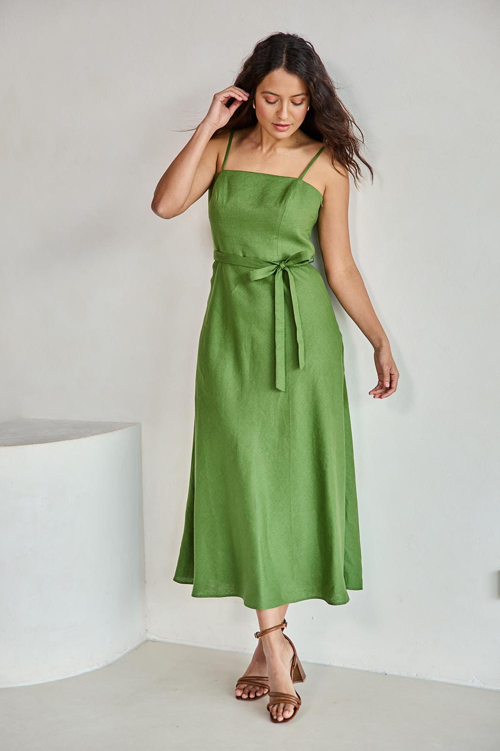 Model Tahneei wearing size 10 of the Linen Riviera Maxi – Green in colour Green, from the front