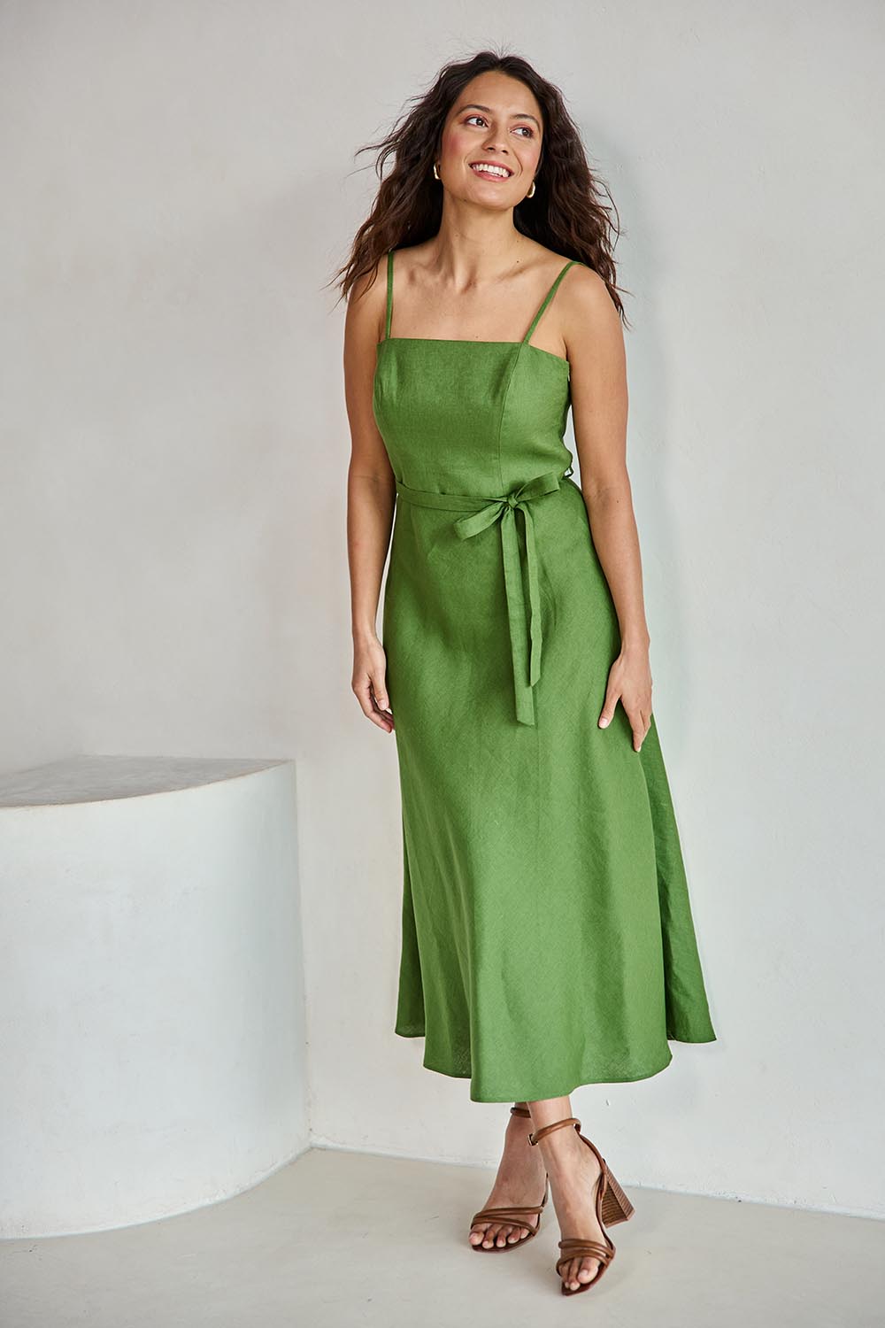 Model Tahneei wearing size 10 of the Linen Riviera Maxi – Green in colour Green, from the front