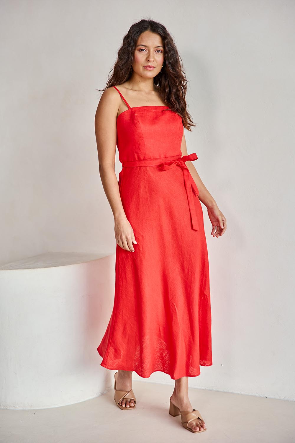 Model Tahneei wearing size 10 of the Linen Riviera Maxi – Red in colour Red, from the front