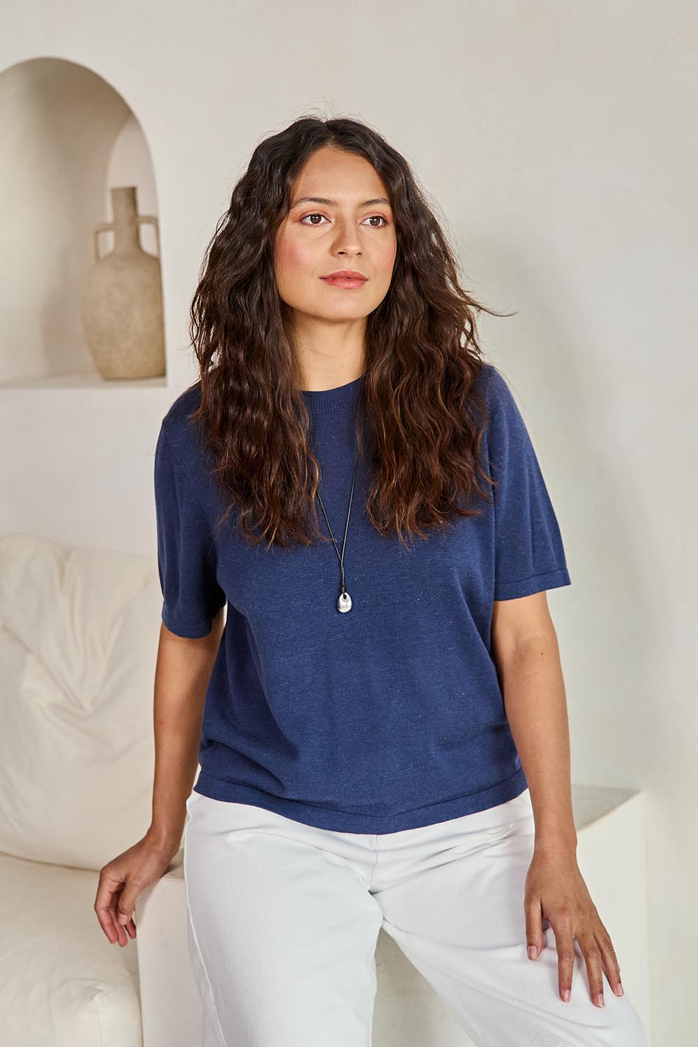 Model Tahneei wearing size 10 of the Linen Lyocell Textured Knit Tee – Blue in colour Blue, in a cropped view