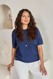 Model Tahneei wearing size 10 of the Linen Lyocell Textured Knit Tee – Blue in colour Blue, in a cropped view