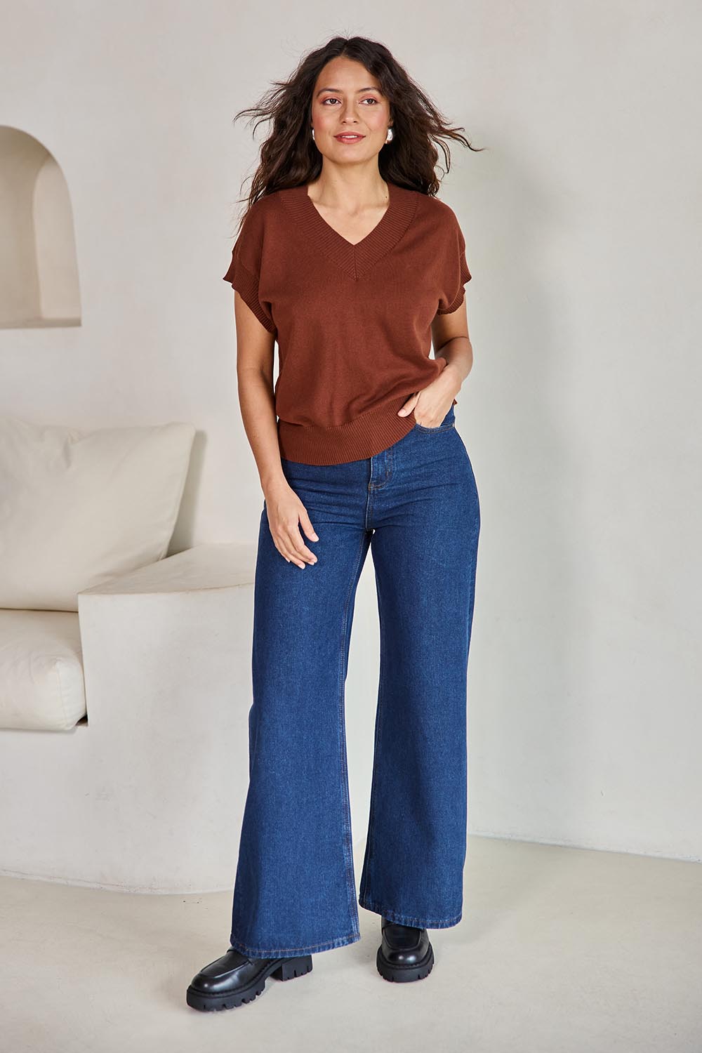 Model Tahneei wearing size 10 of the Cotton Cashmere Relaxed Knit – Caramel in colour Caramel, from the front