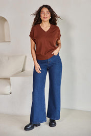 Model Tahneei wearing size 10 of the Cotton Cashmere Relaxed Knit – Caramel in colour Caramel, from the front