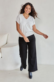 Model Tahneei wearing size 10 of the Cotton Cashmere Relaxed Knit – Dove in colour Dove, from the front