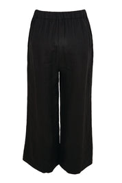 Product shot of the Linen Cropped Drawstring Pant – Black in colour Black, from the back