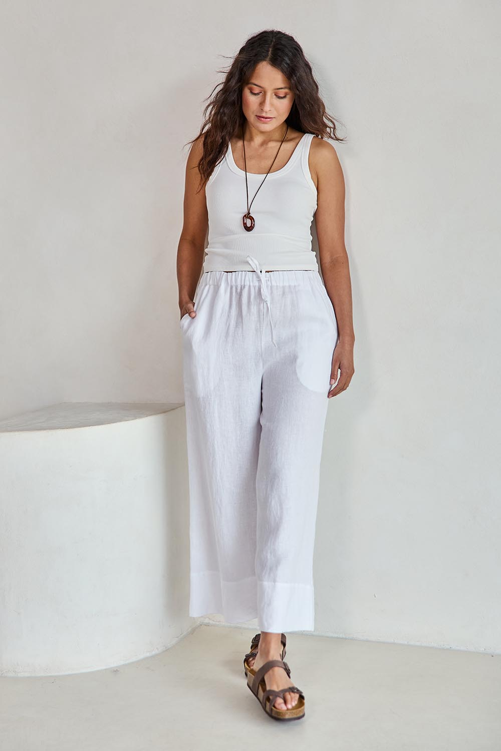 Model Tahneei wearing size 10 of the Linen Cropped Drawstring Pant – White in colour White, from the front