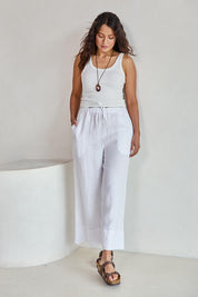 Model Tahneei wearing size 10 of the Linen Cropped Drawstring Pant – White in colour White, from the front