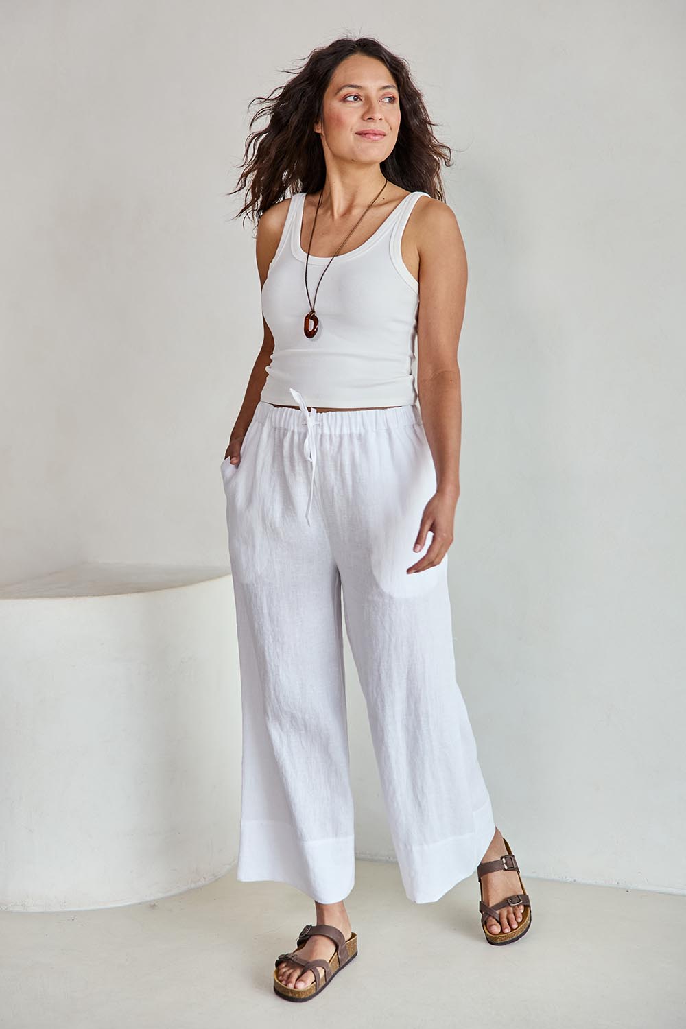 Model Tahneei wearing size 10 of the Linen Cropped Drawstring Pant – White in colour White, from the front