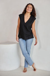 Model Tahneei wearing size 10 of the Linen V Neck Tank – Black in colour Black, from the front