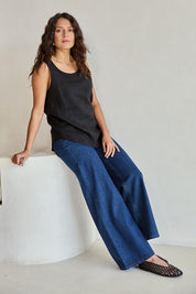 Model Tahneei wearing size 10 of the Linen Tank – Black in colour Black, from the front