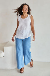 Model Tahneei wearing size 10 of the Linen Tank – White in colour White, from the front