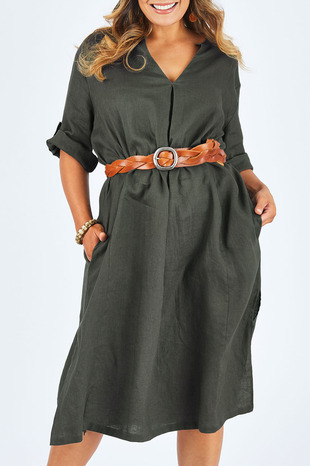 Model Palatina wearing size 14 of the Linen Summer Relaxed Dress in colour Treetop (Green), from the front, cropped image