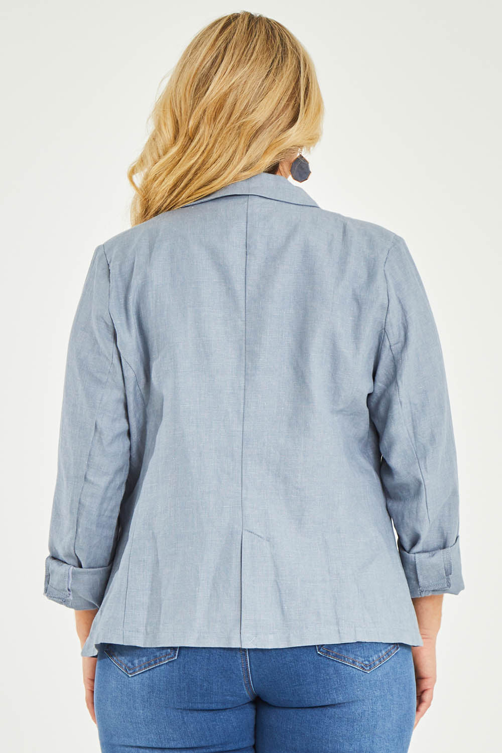 Model Katie wearing size 16 of the Cotton Linen Blazer in colour Chambray (Blue), from the back
