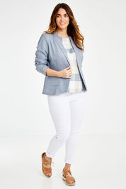 Model Laura wearing size 14 of the Cotton Linen Blazer in colour Chambray (Blue), from the front, showing the whole outfit