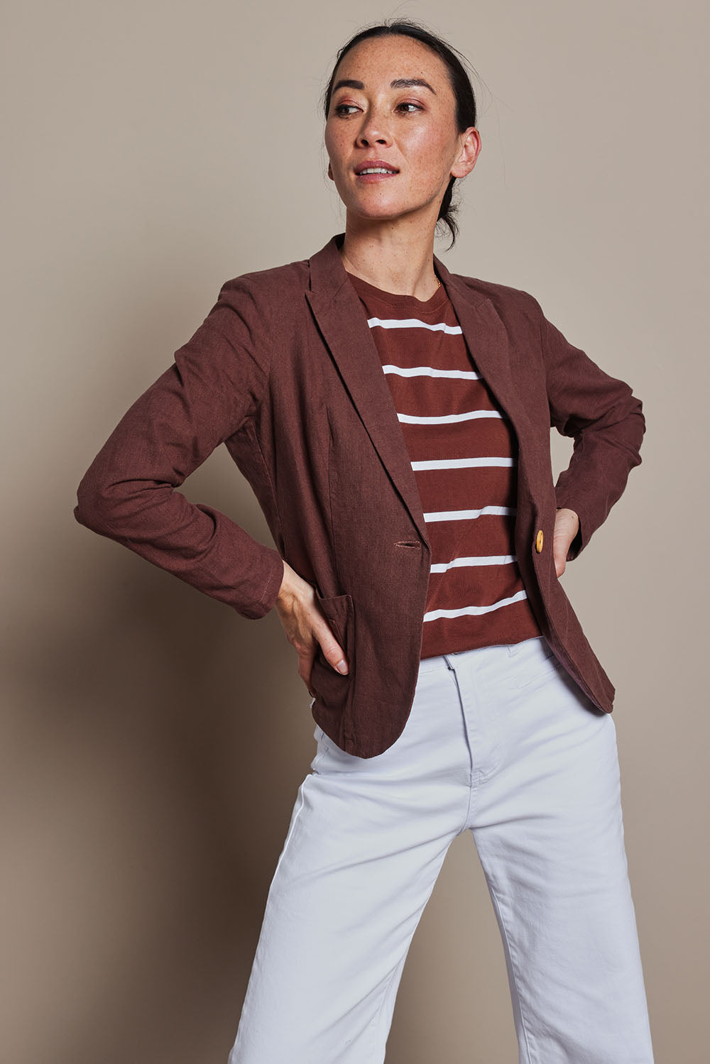 Model Katie wearing size 8 of the Cotton Linen Blazer in colour Chocolate, from the front, cropped image