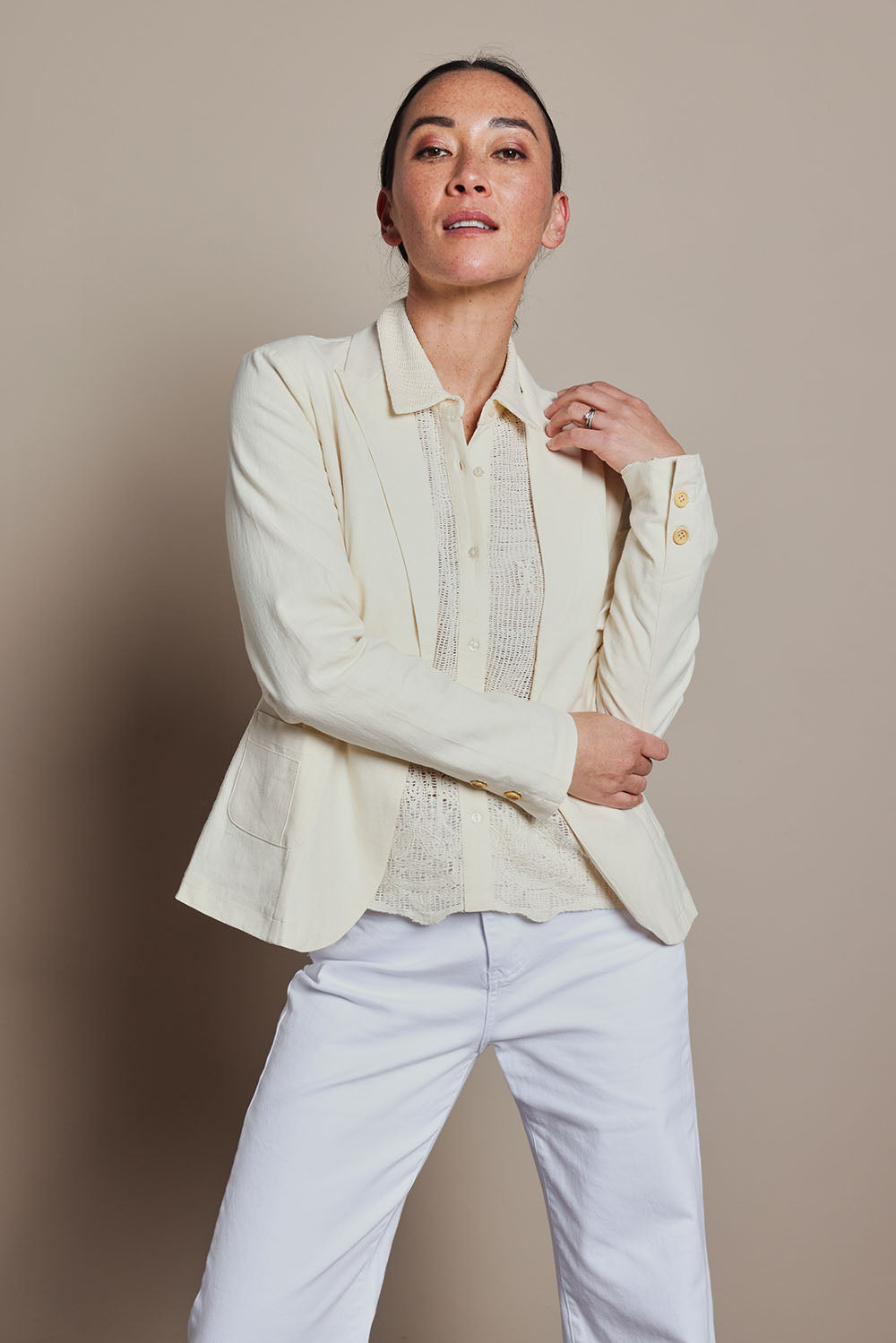Model Katie wearing size 8 of the Cotton Linen Blazer in colour Cream, from the front, cropped image