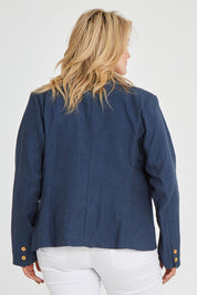 Model Keeara wearing size 16 of the Cotton Linen Blazer in colour Deepocean (Blue), from the back