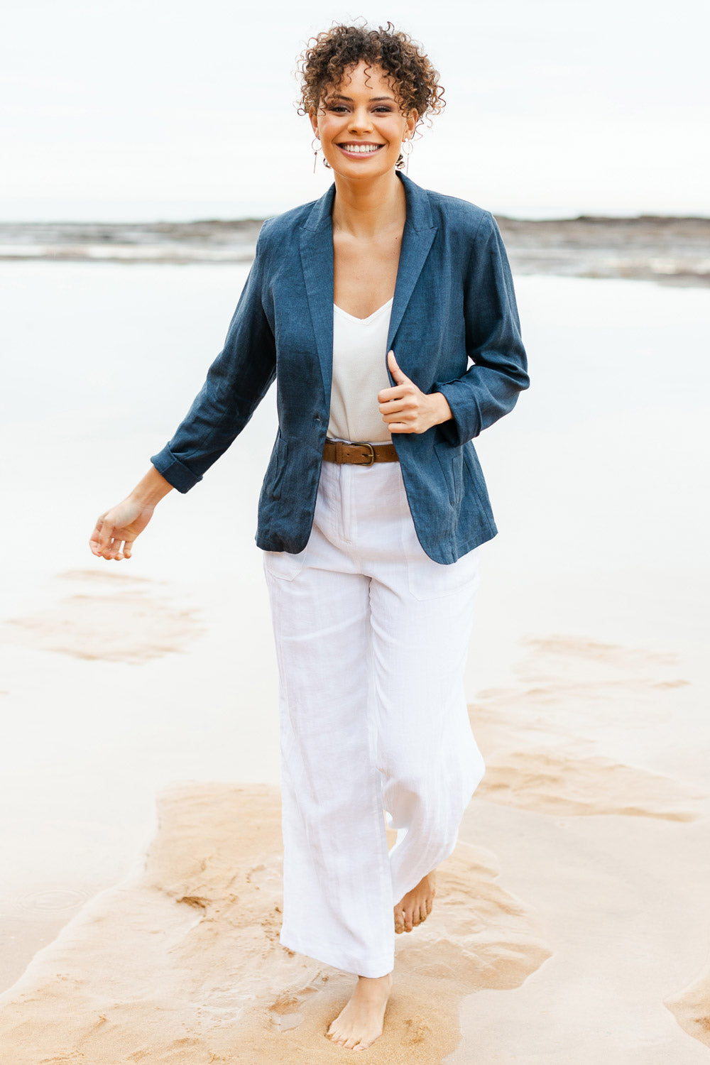 Model Lala wearing size 10 of the Cotton Linen Blazer in colour Deepocean (Blue), from the front, showing the whole outfit