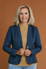 Model Sandy wearing size 10 of the Cotton Linen Blazer in colour Deepocean (Blue), from the front, cropped image
