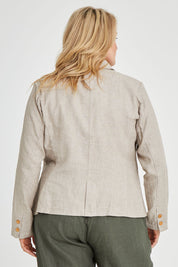 Model Keeara wearing size 16 of the Cotton Linen Blazer in colour Desertsand, from the back
