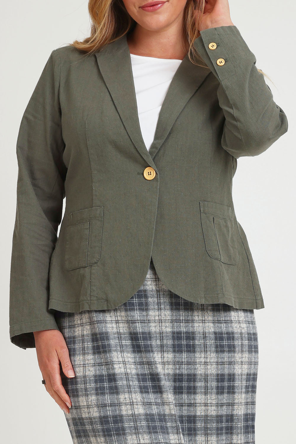 Model Chanel wearing size 16 of the Cotton Linen Blazer in colour Khaki (Green), from the front, cropped image