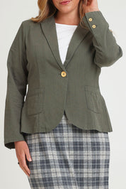 Model Chanel wearing size 16 of the Cotton Linen Blazer in colour Khaki (Green), from the front, cropped image