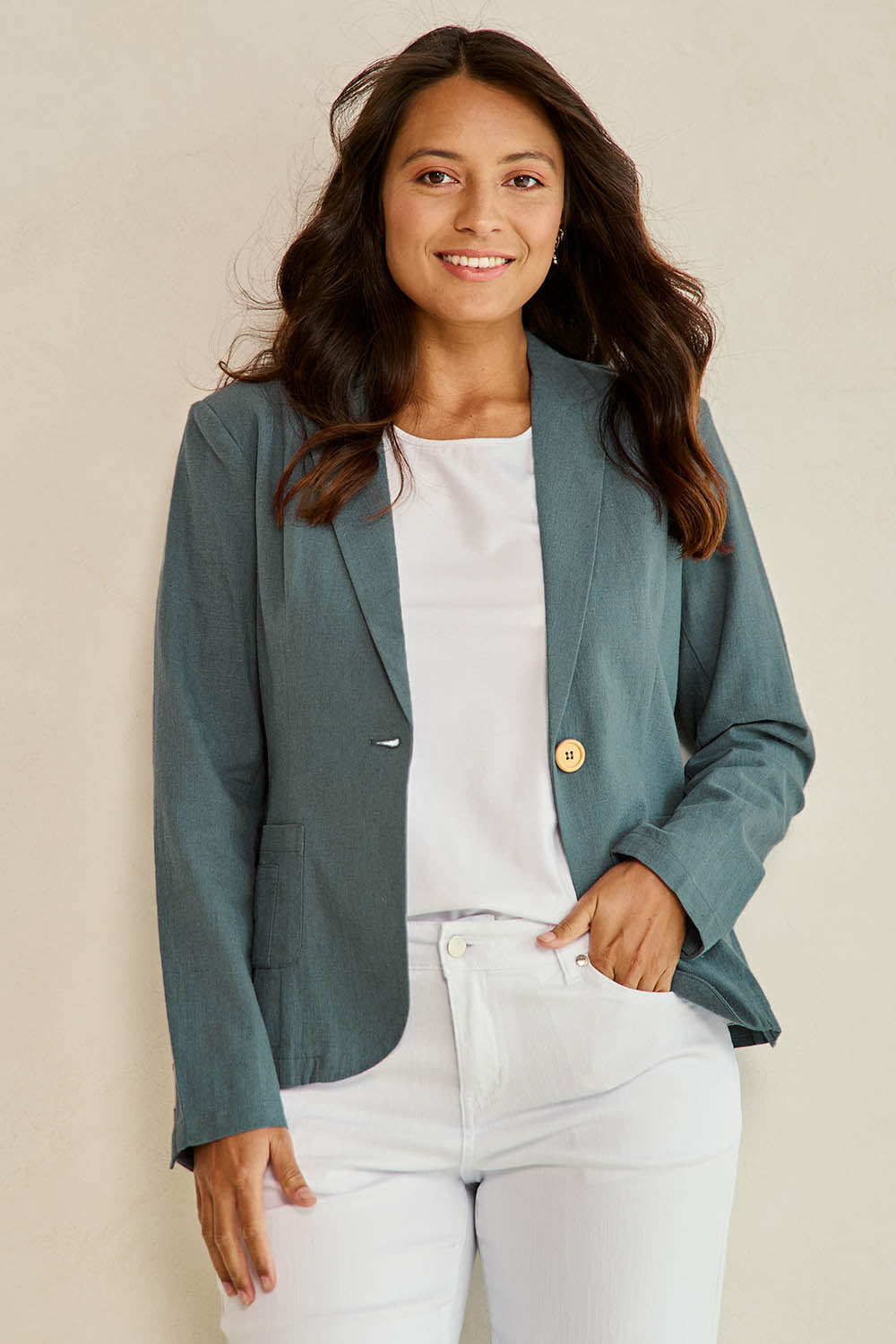 Model Tahnee wearing size 10 of the Cotton Linen Blazer in colour Lagoon (Green), from the front, showing the whole outfit