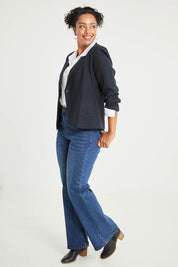 Model Noli wearing size 14 of the Cotton Linen Blazer in colour Midnight (Black), from the front, showing the whole outfit