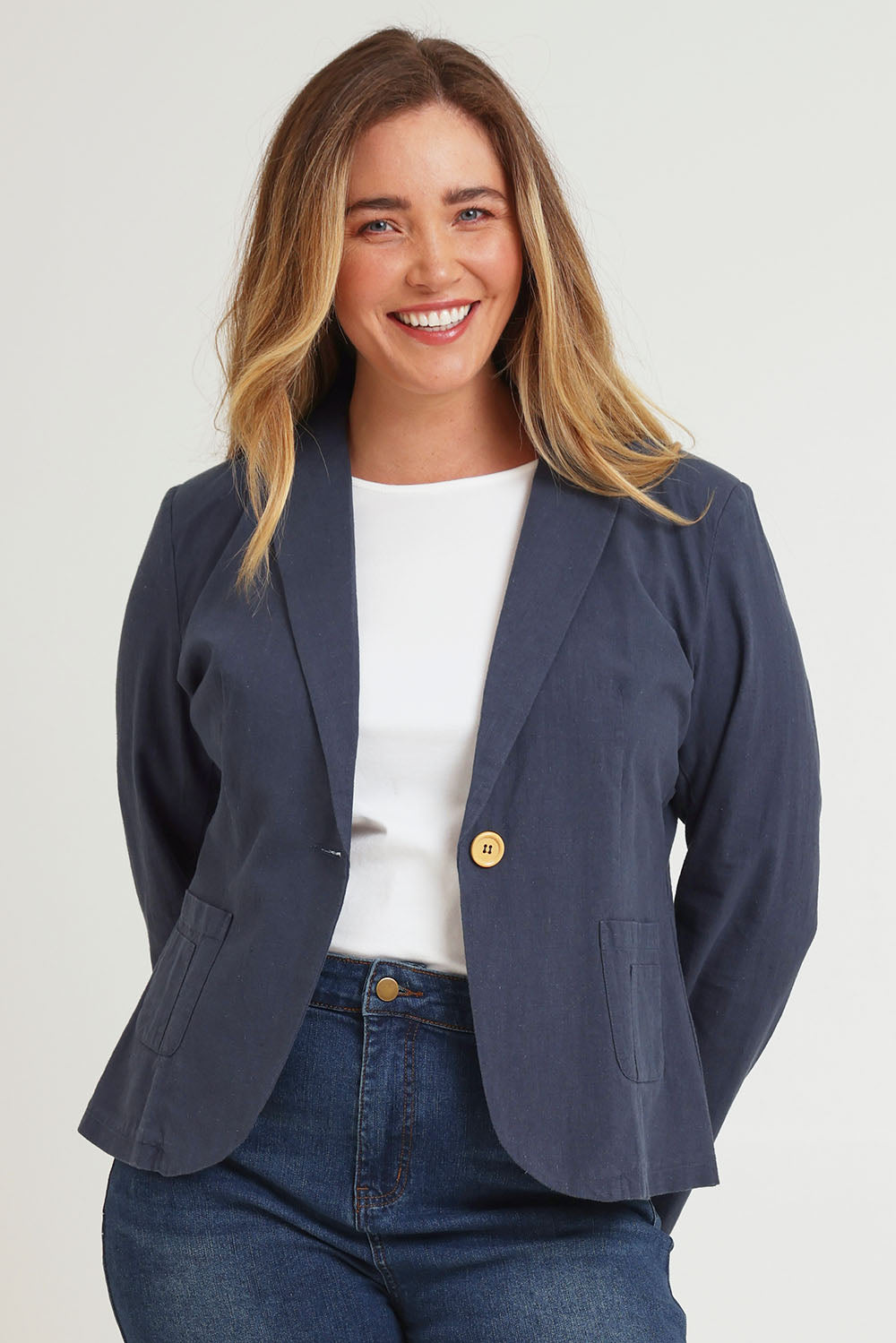 Model Chanel wearing size 16 of the Cotton Linen Blazer in colour Navy (Blue), from the front, cropped image