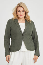 Model Keeara wearing size 16 of the Cotton Linen Blazer in colour Olive (Green), from the front, cropped image