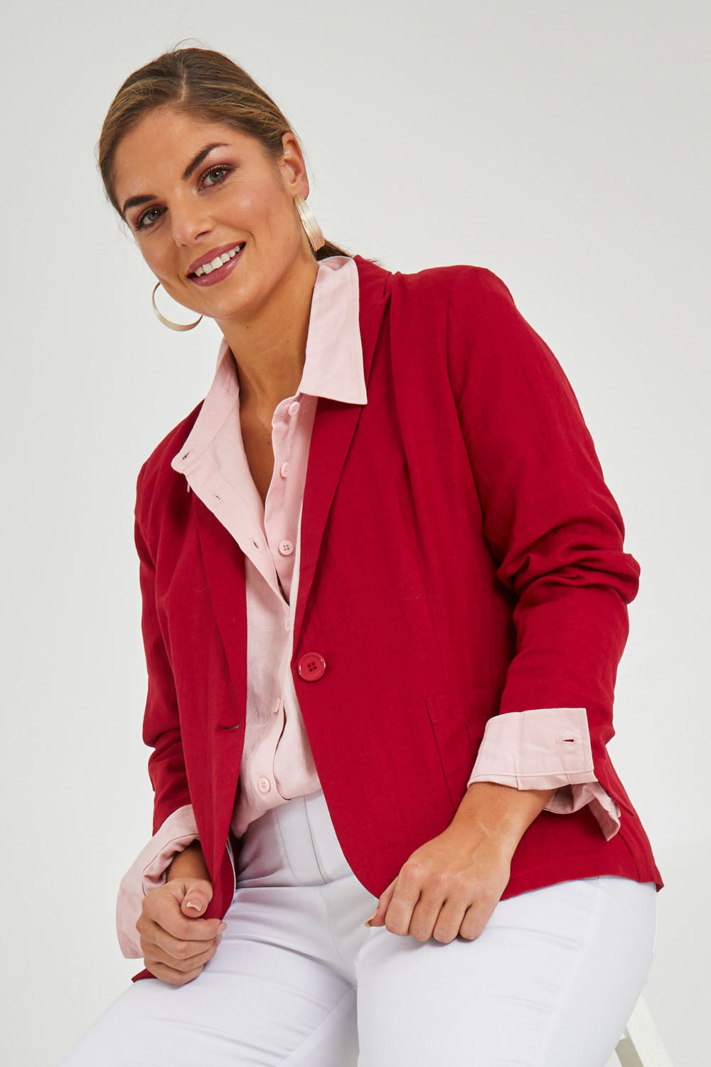Model Monique wearing size 14 of the Cotton Linen Blazer in colour Red (Red), from the front, cropped image